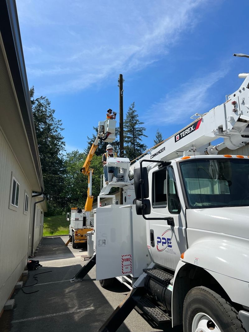 Utility pole installation and electrical distribution work